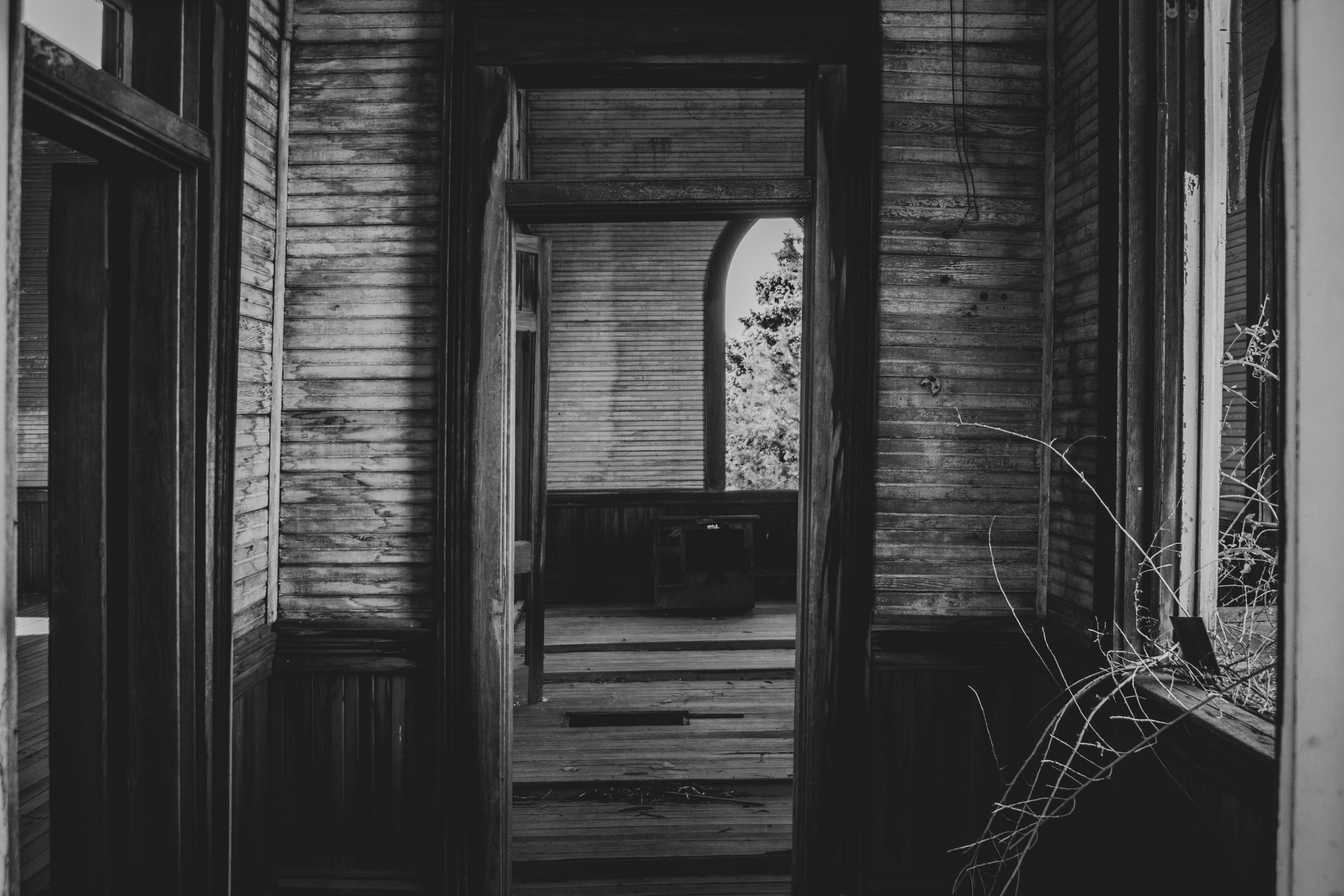 grayscale photo of wooden house